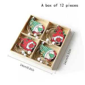 Set of 12 festive wooden gnome ornaments in a wooden box with hanging strings