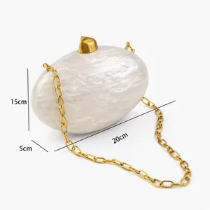 Detailed size view of the cream marble acrylic clutch with gold chain and dimensions