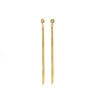 Detailed view of gold titanium steel long tassel earrings with sparkling rhinestones