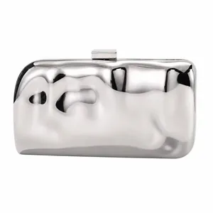 Detail of silver rectangular clutch bag with liquid metal wave texture and square clasp