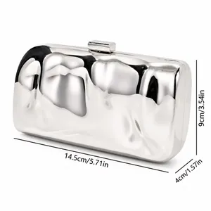 Detail view of silver iron box clutch bag with dimensions and metallic texture