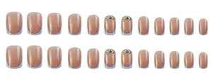 Detail of 24pcs nude and light blue French press-on nails with rhinestone accents