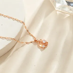 Rose gold stainless steel sun and moon necklace featuring white zircon stone pendant