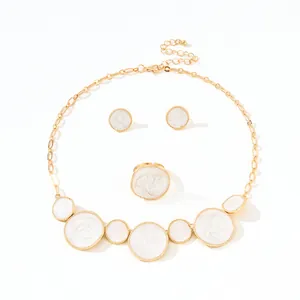 Gold-tone jewelry set with white marble enamel necklace, earrings, and ring in smile layout