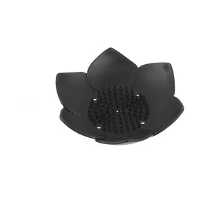 Macro view of black lotus silicone soap dish with flexible non-slip drainage spikes