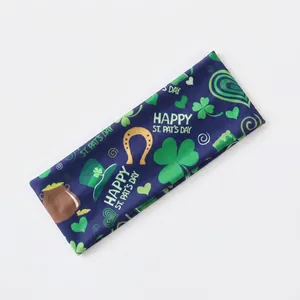 St. Patrick's Day sports headband with shamrock and clover prints on navy blue fabric