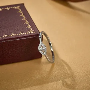 Modern S925 sterling silver evil eye ring with sparkling pave stones in a jewelry box