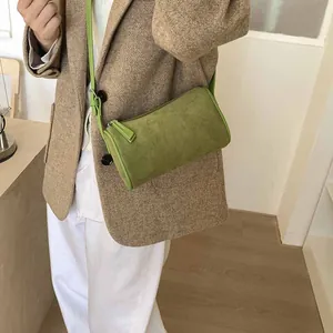 Chic green cylindrical frosted shoulder bag with adjustable strap for a vintage look