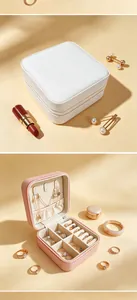 Detail of portable PU leather jewelry box showing interior compartments and ring slots