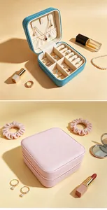 Internal compartments and exterior view of portable faux leather jewelry travel case