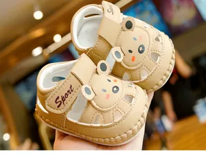 Detail of baby sandal featuring cartoon bear design and breathable side hollow cutouts