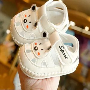 White breathable baby sandals with cute bear design and soft soles for walking
