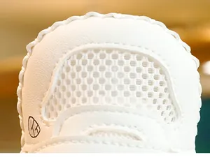 Detail of baby walker shoes featuring honeycomb breathable mesh and wavy white stitching