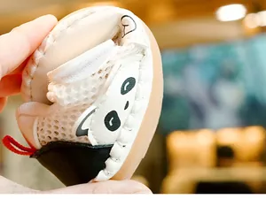 Detail showing high flexibility and bendable soft sole of panda baby walking shoes