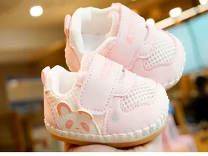 Detail of pink baby walking shoe with breathable mesh and cute panda embroidery
