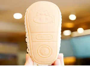 Macro shot of non-slip rubber sole with cartoon pattern for infant walking shoes