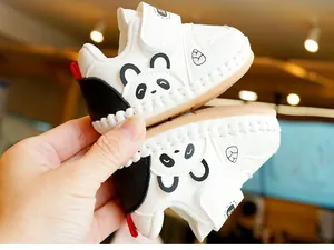 Detail of baby walking shoes with panda design and non-slip rubber sole