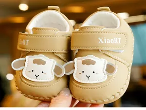 Close-up of soft-sole baby walker shoe featuring a cute 3D cartoon sheep and velcro strap