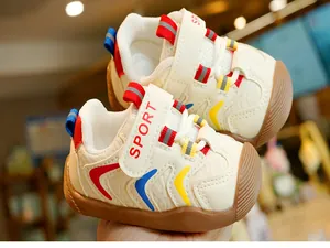 Detail of toddler walking shoes featuring velcro straps and anti-slip rubber soles