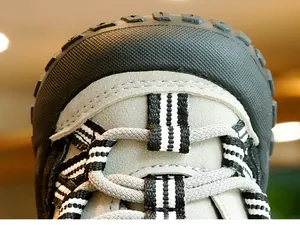 Close-up of baby walking shoes with protective rubber toe cap and durable suede material