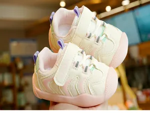 Detail of baby walking shoes with mesh fabric, pink toe protection and sport strap