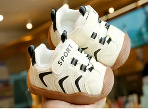 Detail of toddler walking shoe with non-slip rubber sole and velcro sport strap