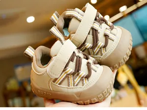 Detailed close-up of khaki baby walking shoes with soft non-slip soles and velcro strap