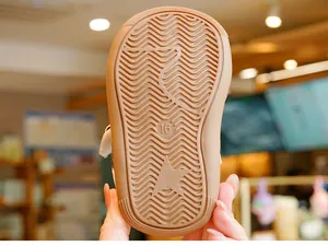 Detail view of anti-slip rubber sole for toddler shoes with star logo and size 16