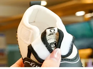Detail shot of baby walking shoes with hook and loop closure and breathable mesh lining