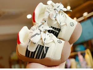 Close-up of baby walking shoes featuring breathable mesh and anti-slip rubber soles