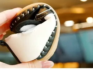 Close-up of flexible soft sole baby walking shoes with durable black and white leather