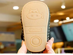Detailed view of non-slip soft rubber sole with submarine pattern for infant walker shoes