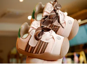 Close-up of pink toddler walking shoes with velcro strap and non-slip rubber sole