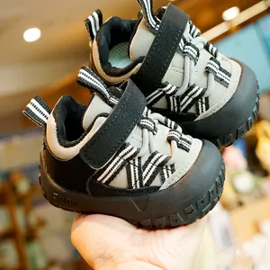 Gray toddler walking shoes with anti-slip rubber soles and velcro strap closure