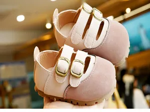 Detail of baby Mary Jane walking shoes featuring double buckle straps and non-slip rubber soles