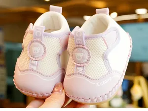 Close-up of pink baby shoes with breathable mesh, bear patch, and hand-stitched sole