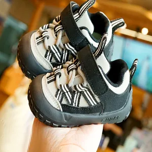 Breathable baby walker shoes in black and grey with non-slip soft rubber soles for infants
