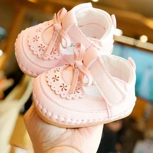 Pink infant princess walker shoes with breathable lace cutouts and decorative bow