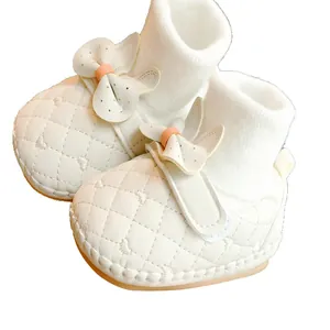 White quilted leather baby walking shoes with wing bow decoration and knit sock cuffs
