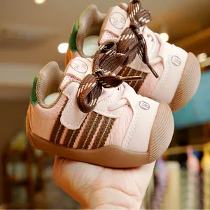 Pink toddler walking shoes with breathable stripes and non-slip rubber soles