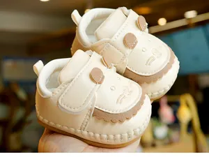 Detailed view of soft baby shoes with cute cat embroidery and soft non-slip soles