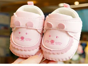 Close-up of pink baby walking shoes with cute animal embroidery and soft PU material