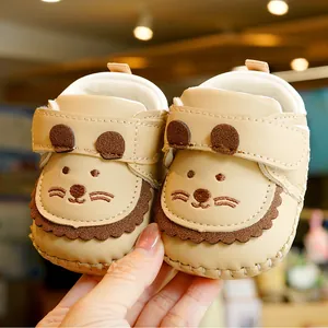 Soft leather baby walking shoes with cute cartoon lion design and non-slip soles