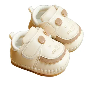 Cute cream animal baby walking shoes with soft non-slip soles and ear details