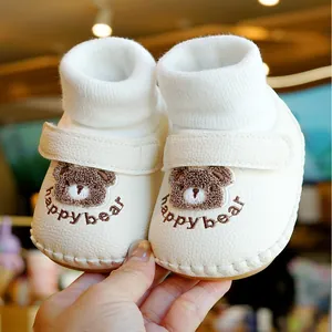 Cream soft sole baby walker shoes with cartoon bear embroidery and velcro strap