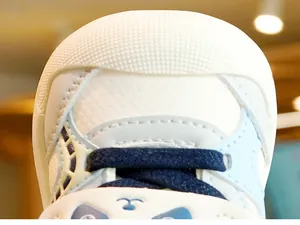 Detailed close-up of non-slip rubber toe cap with cute panda pattern on toddler shoes
