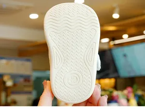 Close-up of flexible rubber sole with wave pattern and anti-slip texture for baby shoes