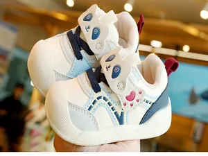 Close-up of baby walker shoe with cute panda velcro strap and anti-slip thick white sole