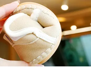 Detail of baby winter shoe showing high flexibility and soft faux suede with warm fleece lining