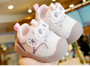 Close-up of pink toddler sneaker with cute purple panda patch and breathable mesh upper